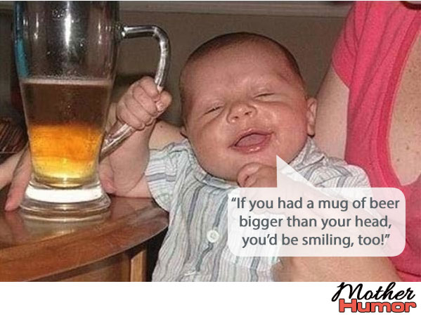 Funny baby holding beer